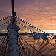 Sunset over the Argentine Islands seen from sailing ship, Antarctica