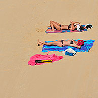 Sunbathers sunning on beach in summer at Fouras, Charente-Maritime, France