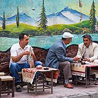 Turkish and Kurdish men having tea at a sidewalk cafe in the city Van, Eastern Turkey