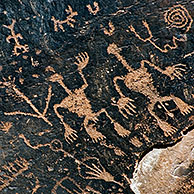 'Newspaper Rock' Anasazi Indian petroglyphs showing anthropomorphs (human-like figures), zoomorphs (animal-like figures) and katsinas (spiritual figures), Petrified Forest National Park, Arizona, USA